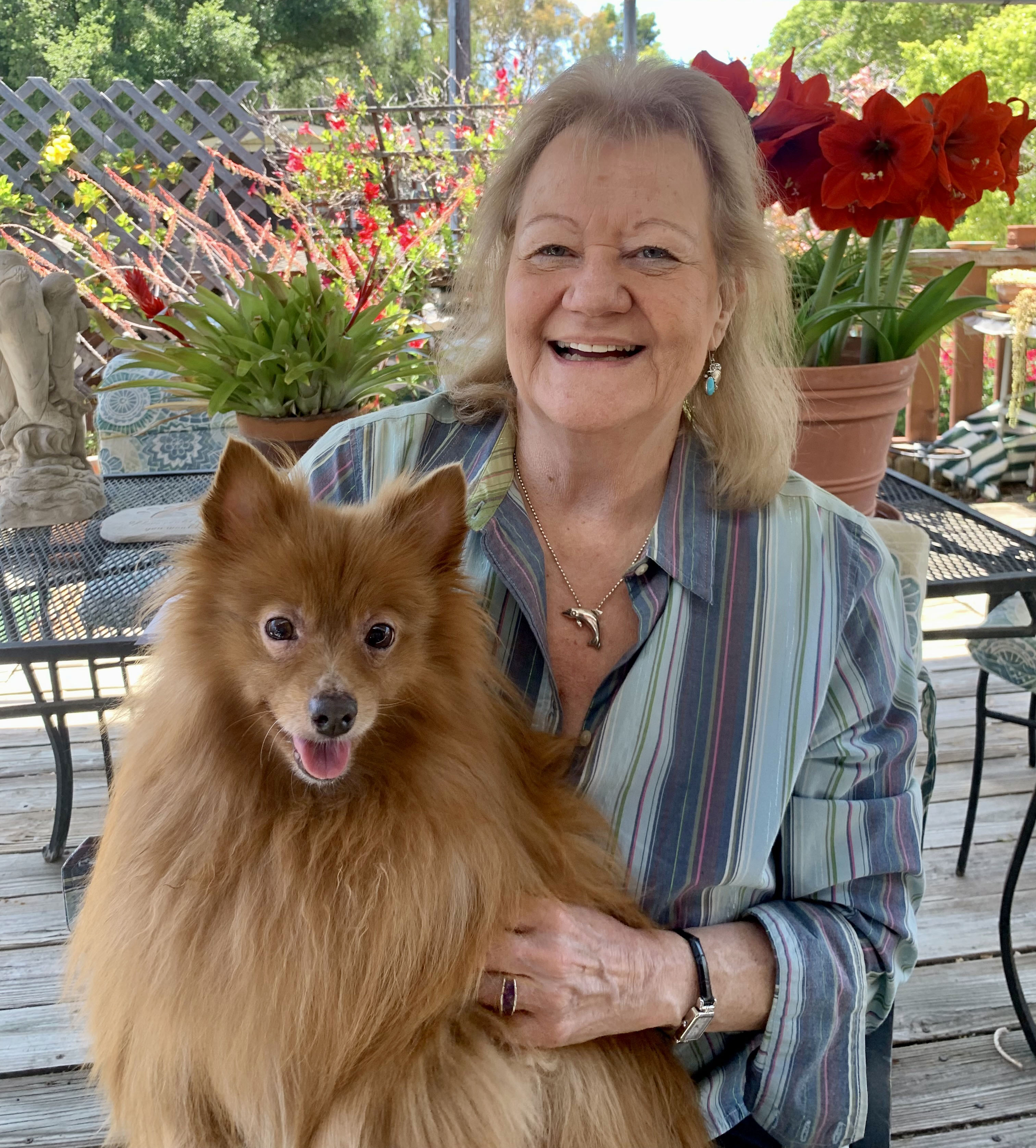 Paula and Jojo woman with dog in lap