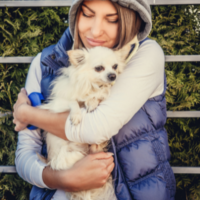 Woman Hugging Dog