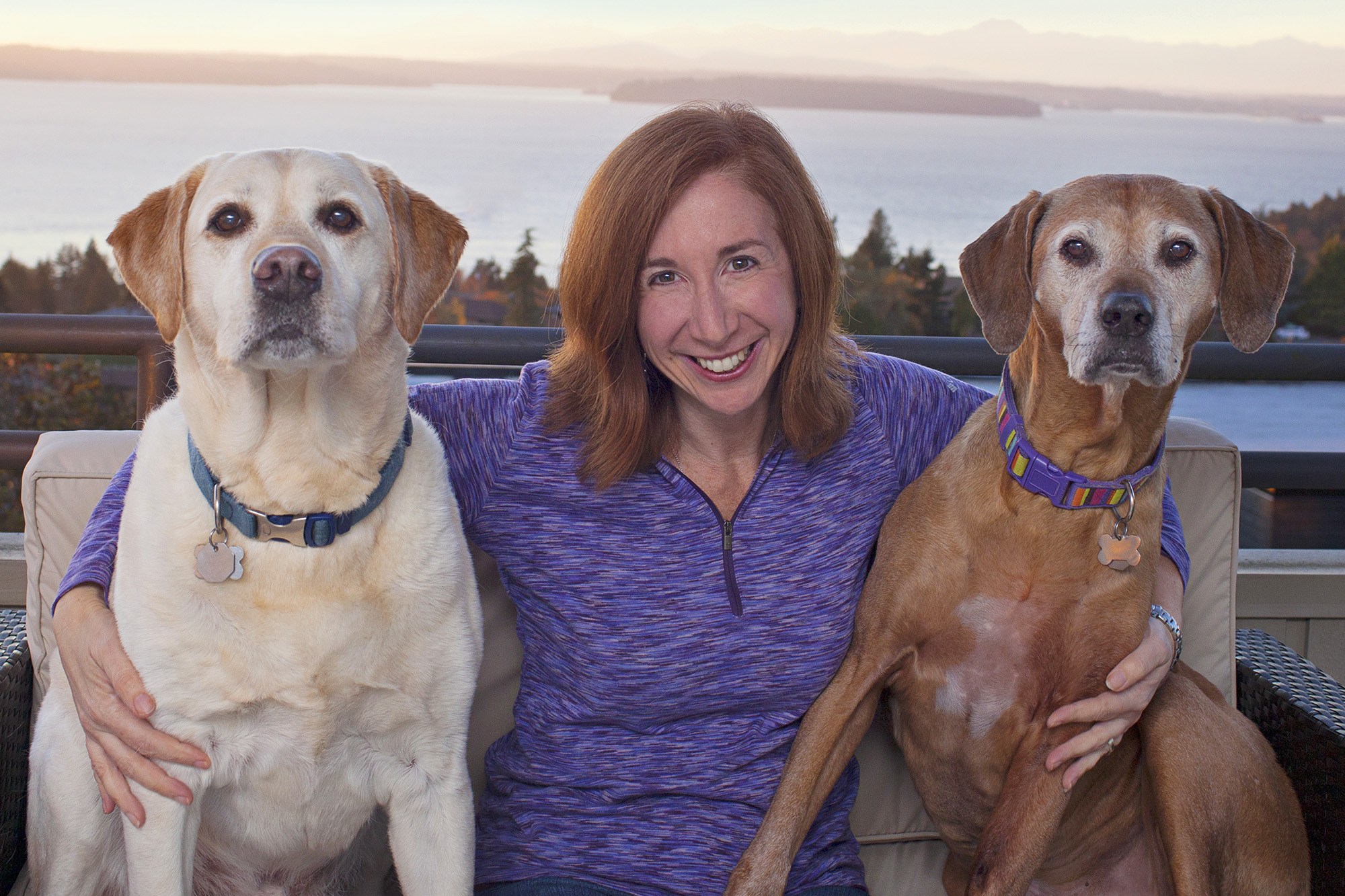 Laura Coffey with her two dogs brown haired woman with two dogs