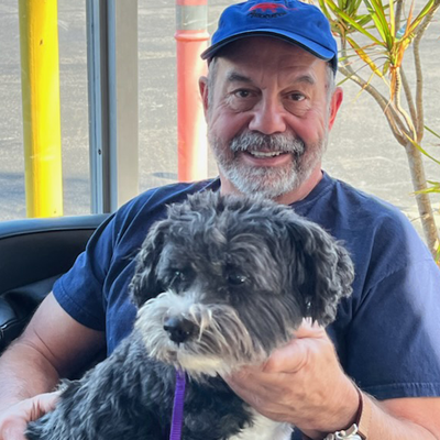 Man with Dog in Lap