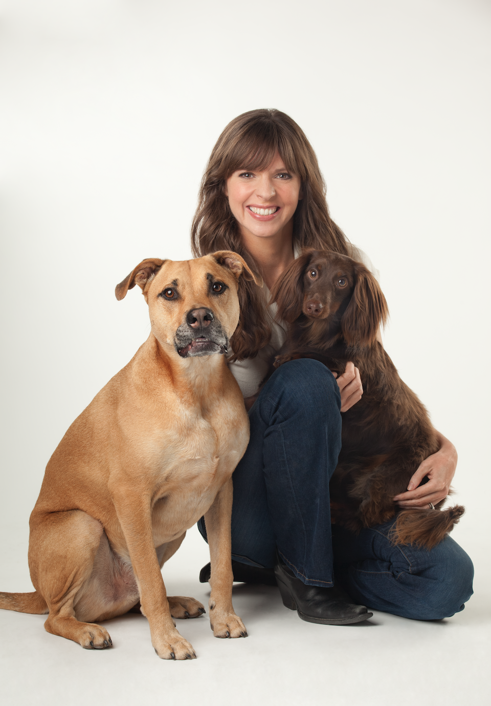 Victoria Stillwell and her two dogs brown haired woman with two dogs