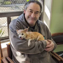 Wedow Man holding small dog