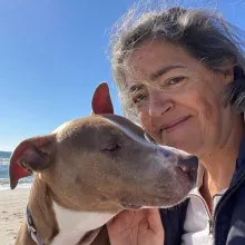 Penny Dog and woman at beach