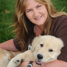 Jenny Kachnic, President, with her Golden Retriever puppy